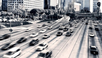 1600x900_highway-cars-city-traffic-buildings-black-white