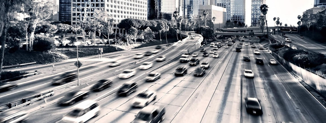 1600x900_highway-cars-city-traffic-buildings-black-white